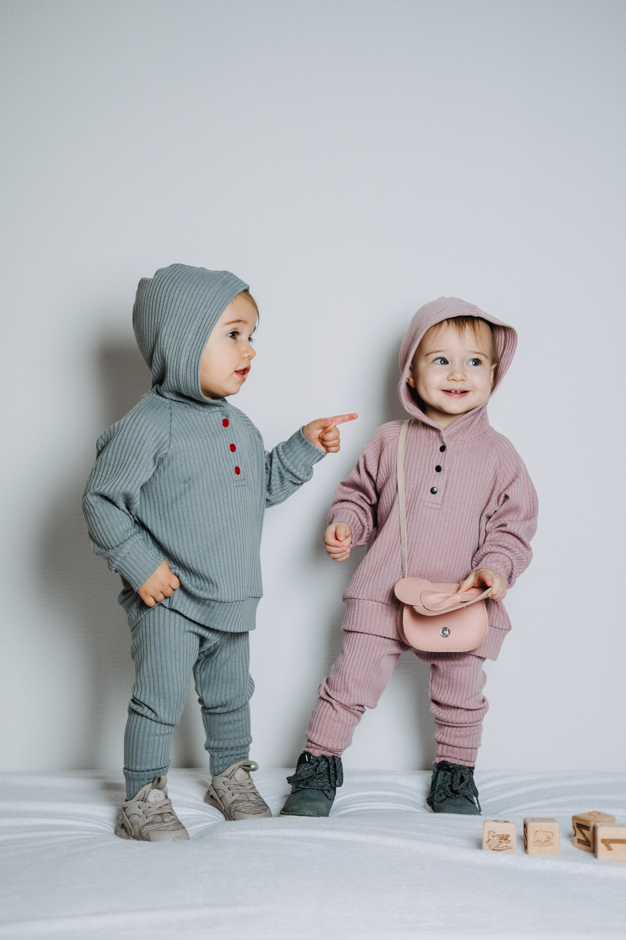 Baby fashion. Unisex gender neutral clothes for babies. Two